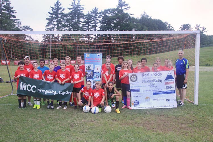 soccer camp kids with Karl's Kids sign